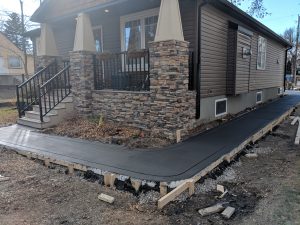 Coloured broomed sidewalk with cut border