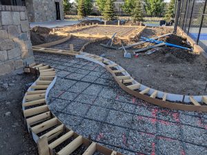 Curved concrete sidewalk border prep